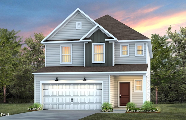 view of front of house with a garage and a lawn