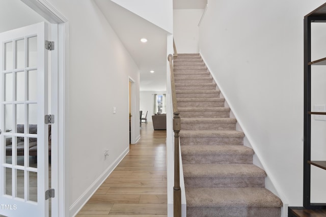 stairway featuring hardwood / wood-style floors