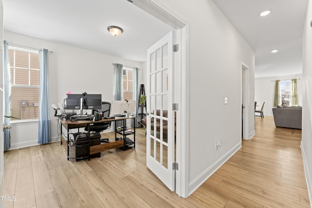 office area with light hardwood / wood-style flooring