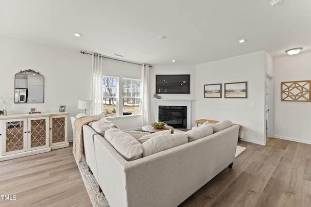 living room with light hardwood / wood-style floors