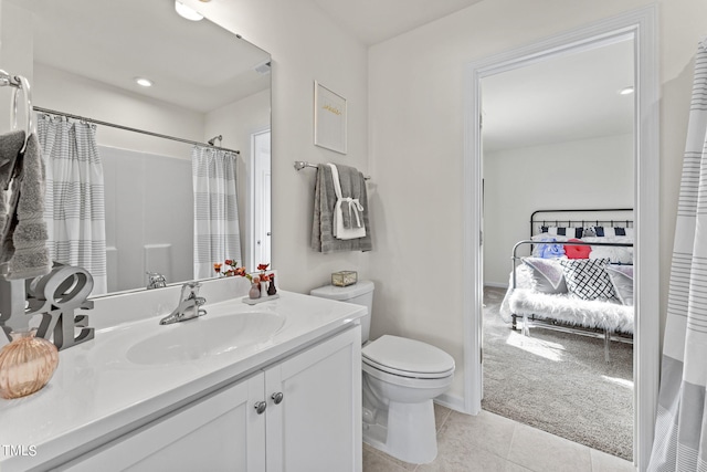 bathroom featuring vanity, toilet, and tile patterned floors