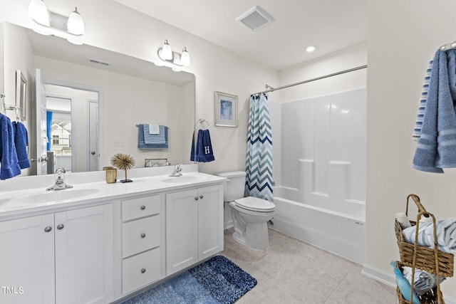 full bathroom with toilet, vanity, and shower / tub combo