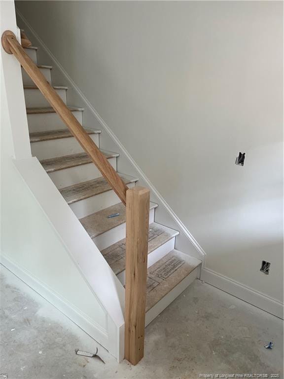 181 Pinecrest Dr, Carthage, NC 28327 - staircase with unfinished concrete floors and baseboards