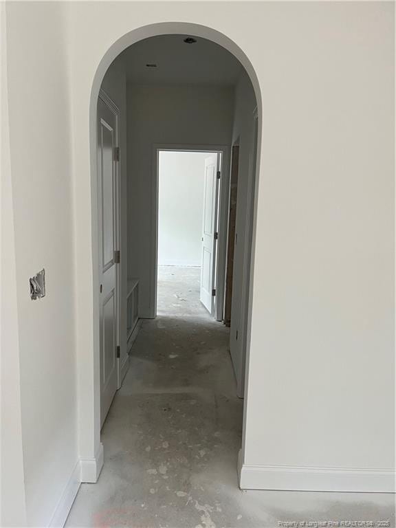 181 Pinecrest Dr, Carthage, NC 28327 - hallway with unfinished concrete flooring and baseboards
