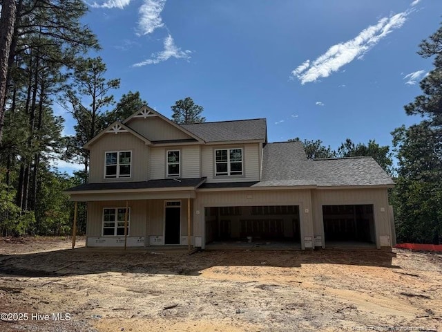 161 Pinecrest Dr, Carthage, NC 28327 - view of front of property featuring covered porch, roof with shingles, driveway, and a garage