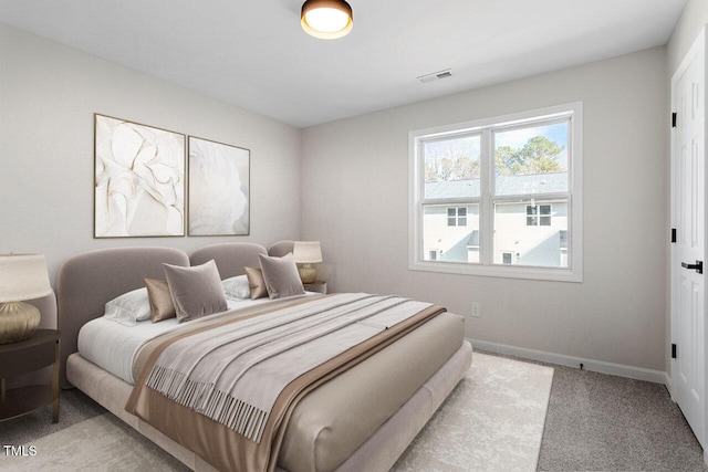 bedroom featuring light colored carpet