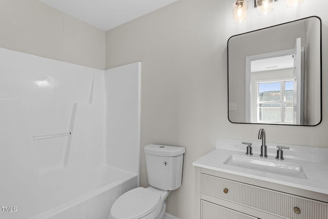 bathroom with toilet and vanity