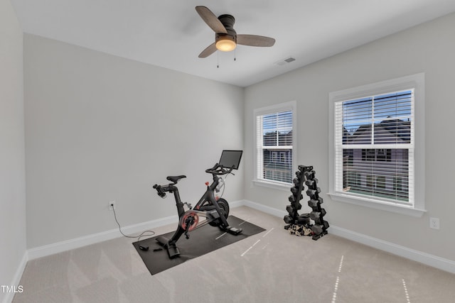 workout room with a ceiling fan, baseboards, visible vents, and carpet floors