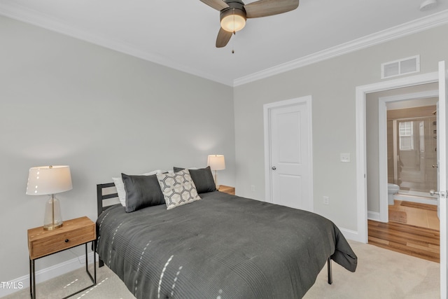 bedroom with visible vents, carpet flooring, baseboards, and ornamental molding