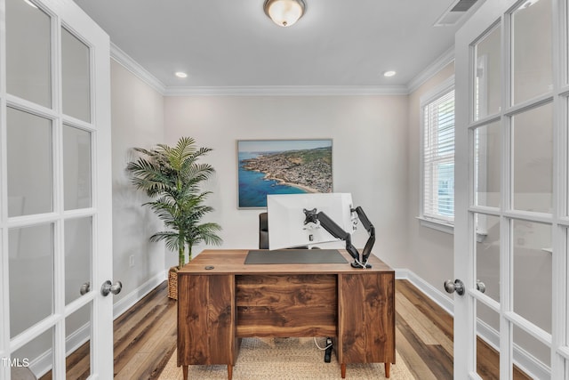 office space featuring crown molding, wood finished floors, french doors, and visible vents