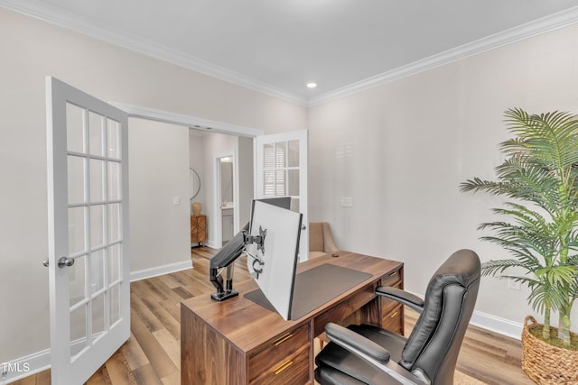 office area featuring wood finished floors, baseboards, french doors, and ornamental molding