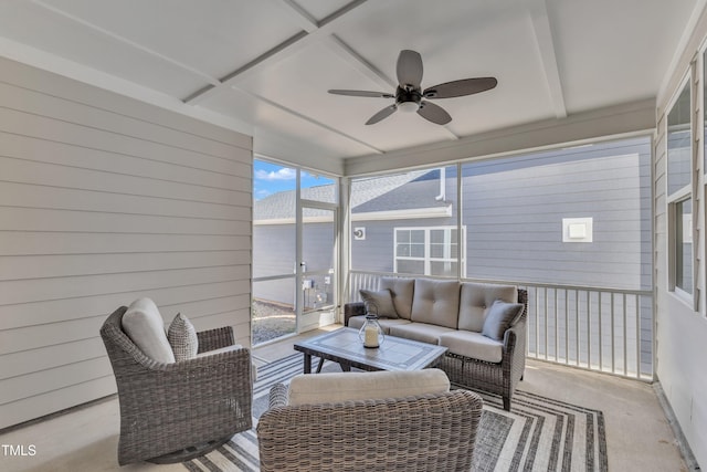 sunroom / solarium with coffered ceiling and a ceiling fan