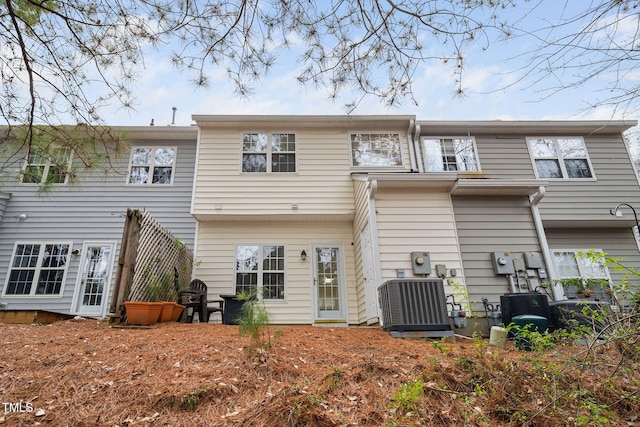 back of house featuring central air condition unit