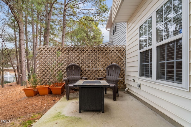 view of patio / terrace featuring an outdoor fire pit