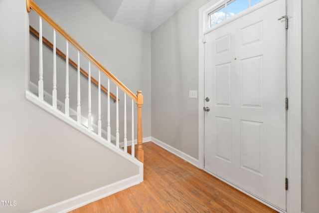 foyer entrance with light hardwood / wood-style flooring