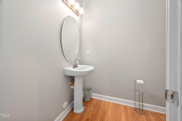 bathroom with sink and hardwood / wood-style floors