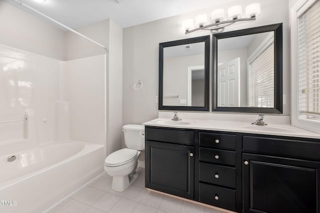 full bathroom featuring toilet, vanity, and bathing tub / shower combination