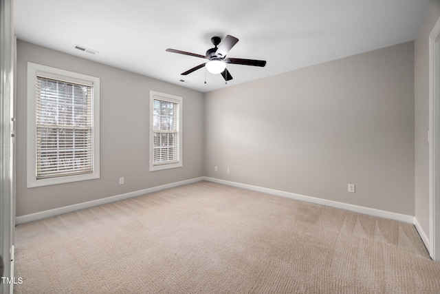 carpeted empty room with ceiling fan