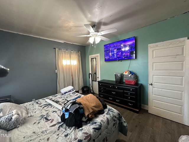 bedroom with ceiling fan and dark hardwood / wood-style flooring