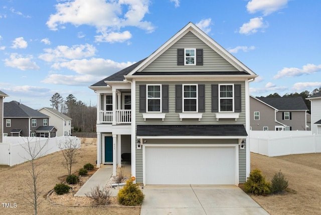 view of front of home with a balcony and a garage