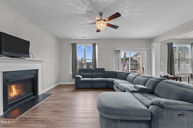 living room with hardwood / wood-style floors and ceiling fan