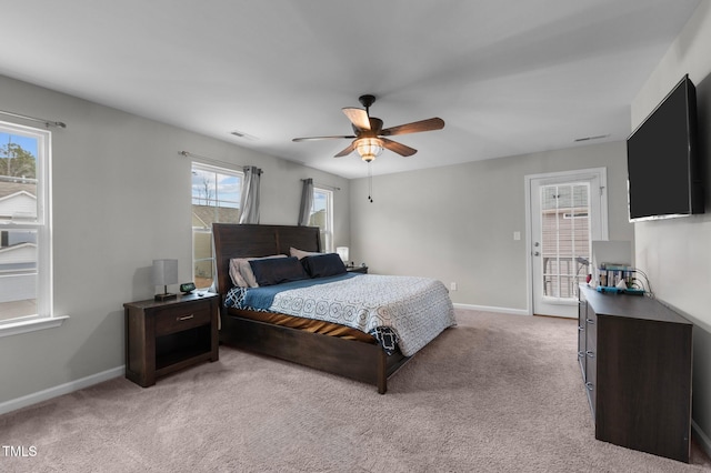 bedroom featuring light carpet and ceiling fan