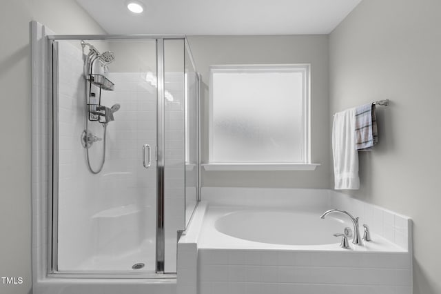 bathroom with separate shower and tub