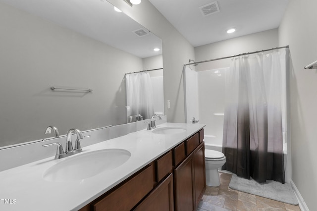 full bathroom featuring toilet, vanity, and shower / bath combination with curtain