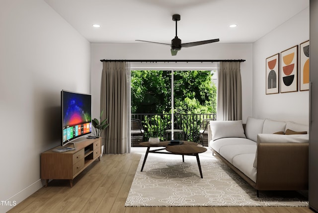 living room with ceiling fan and light hardwood / wood-style floors