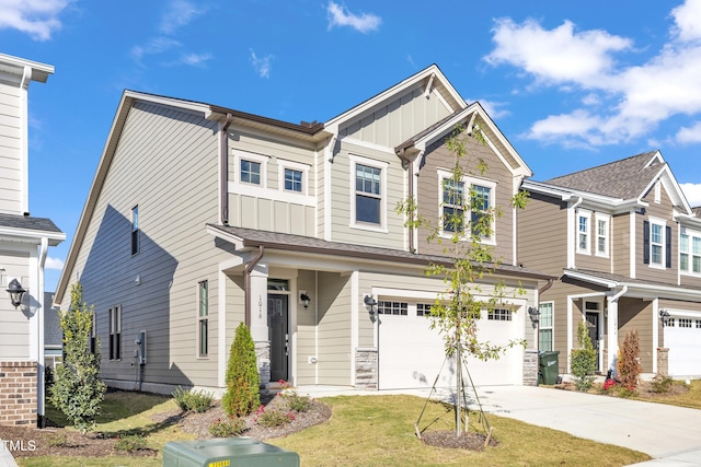 view of front of house with a garage and a front yard