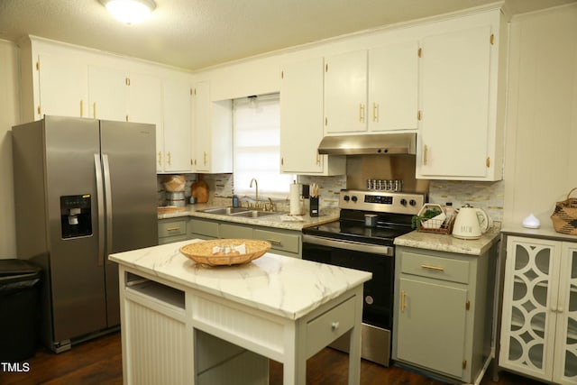 kitchen with sink, gray cabinetry, a kitchen island, stainless steel appliances, and white cabinets