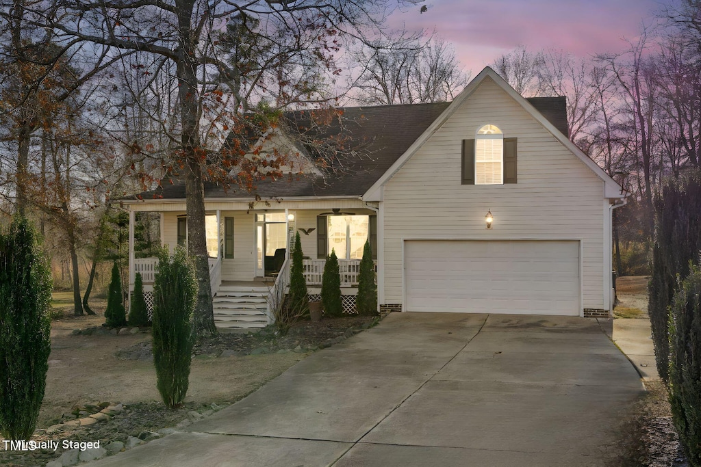 view of front of home with a garage and a porch