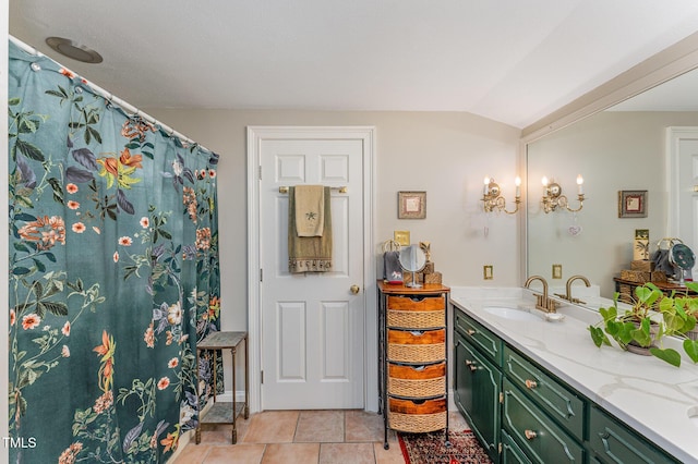 full bathroom with tile patterned flooring, vanity, and lofted ceiling