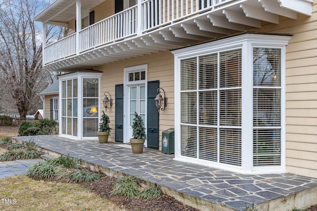 entrance to property with a balcony