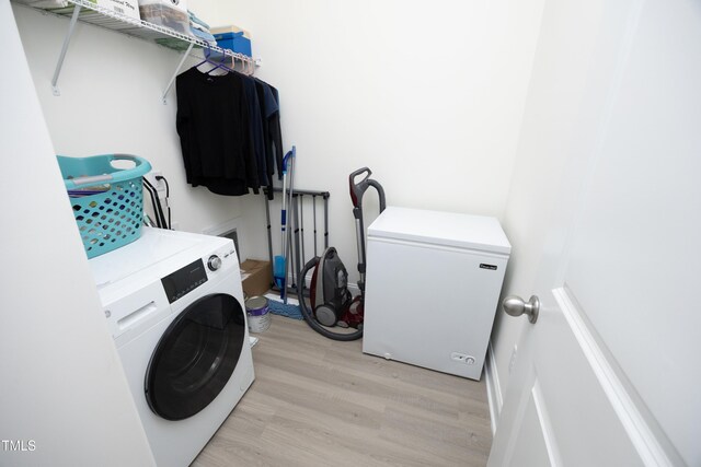 978 Bonanza Ln Unit 163, Mebane, NC 27302 - laundry room featuring washer / clothes dryer and light hardwood / wood-style floors