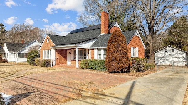 view of front facade featuring covered porch and solar panels