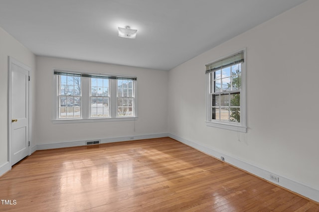 unfurnished room featuring light hardwood / wood-style floors