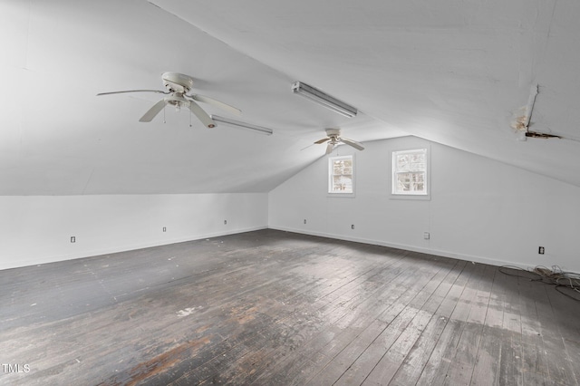 bonus room with ceiling fan, dark hardwood / wood-style flooring, and vaulted ceiling