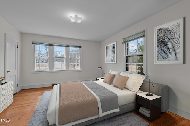 bedroom with light wood-type flooring