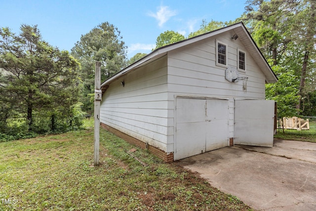 801 Williamsboro St, Oxford, NC 27565 - view of home's exterior featuring a lawn, an outbuilding, and a detached garage