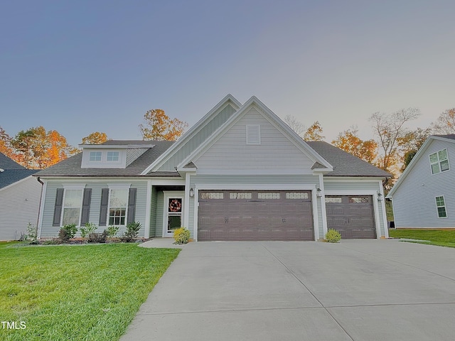 view of front facade with a garage and a front yard