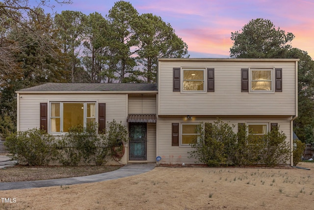 view of front of house with a lawn