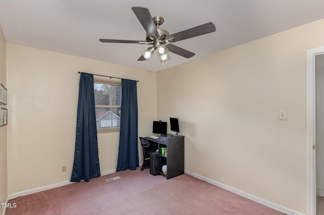 office space featuring light colored carpet and ceiling fan