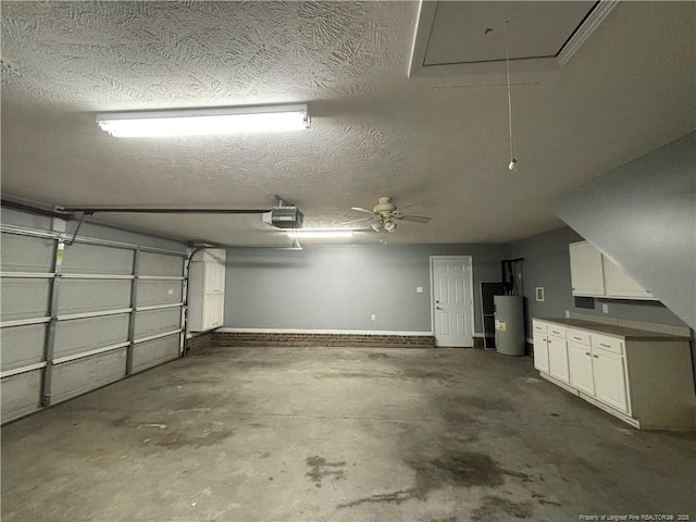 garage with a garage door opener and electric water heater