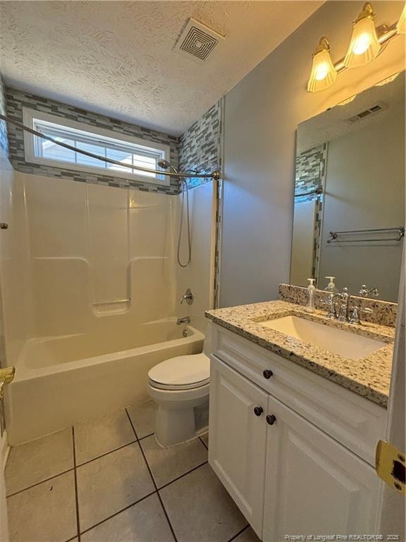 full bathroom with tile patterned flooring, toilet, a textured ceiling, vanity, and shower / bath combination