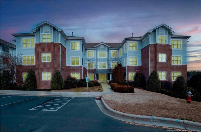 view of outdoor building at dusk