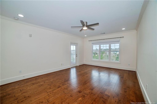 empty room with baseboards, ceiling fan, hardwood / wood-style floors, and crown molding