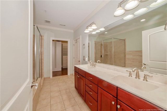 full bathroom with ornamental molding, a stall shower, visible vents, and a sink