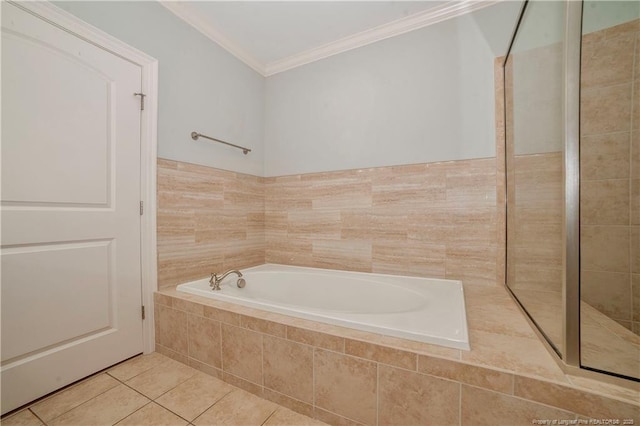 full bathroom with ornamental molding, tile patterned flooring, a garden tub, and a tile shower