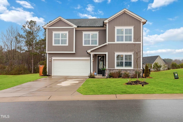 view of front of home featuring a garage and a front yard